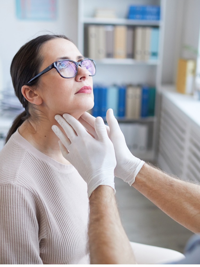 doctor examining woman in clinic picture id1296415671